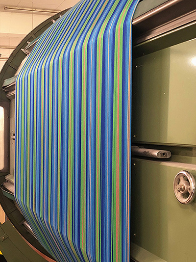 Blue & Green Yarn On The Warp Mill at Warping Stage