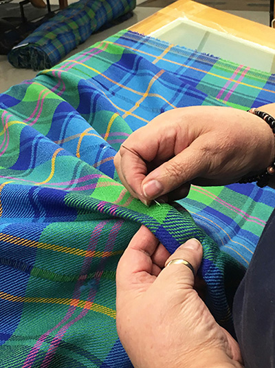 The Official RDA Tartan by Lochcarron of Scotland being Darned by Hand