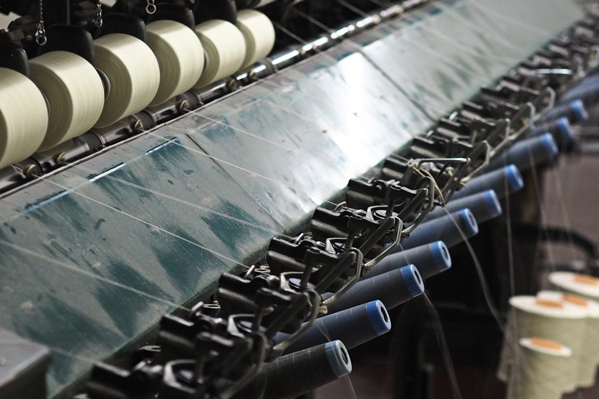 Yarn winding onto cones on winding machine