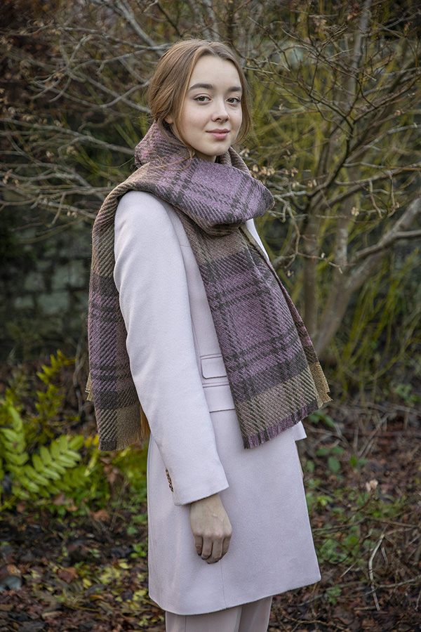 Model wears Cranston Blossom Stole with garden in background