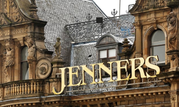 Modern day jenners signage in gold text on the front of their store. 